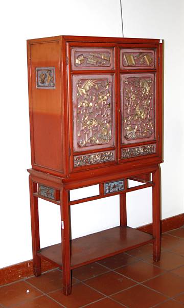 Appraisal: A red and gilt lacquered wood two-door cabinet on stand