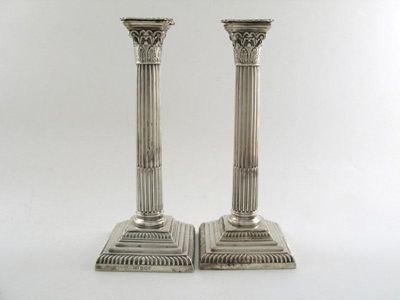 Appraisal: A pair of late-Victorian silver candlesticks of Corinthian column form