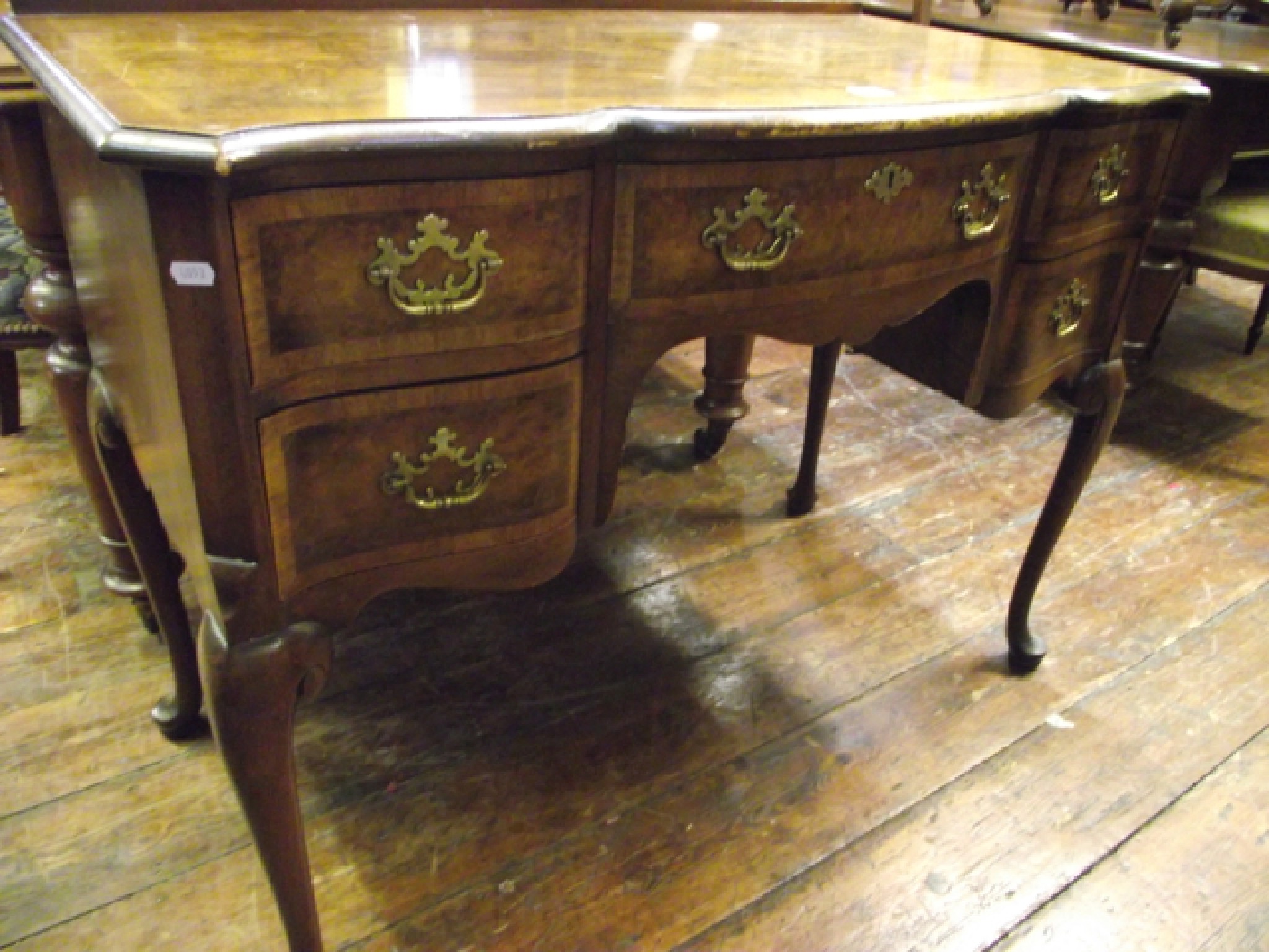 Appraisal: A Queen Anne style writing dressing table with shaped outline