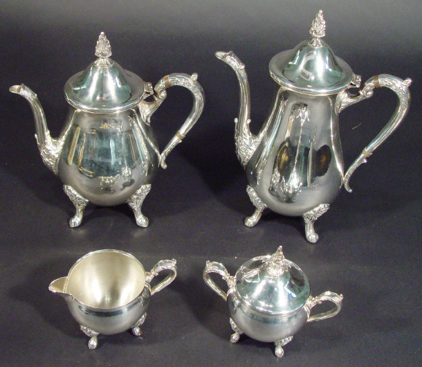 Appraisal: Silver plated four piece tea service cast with floral design