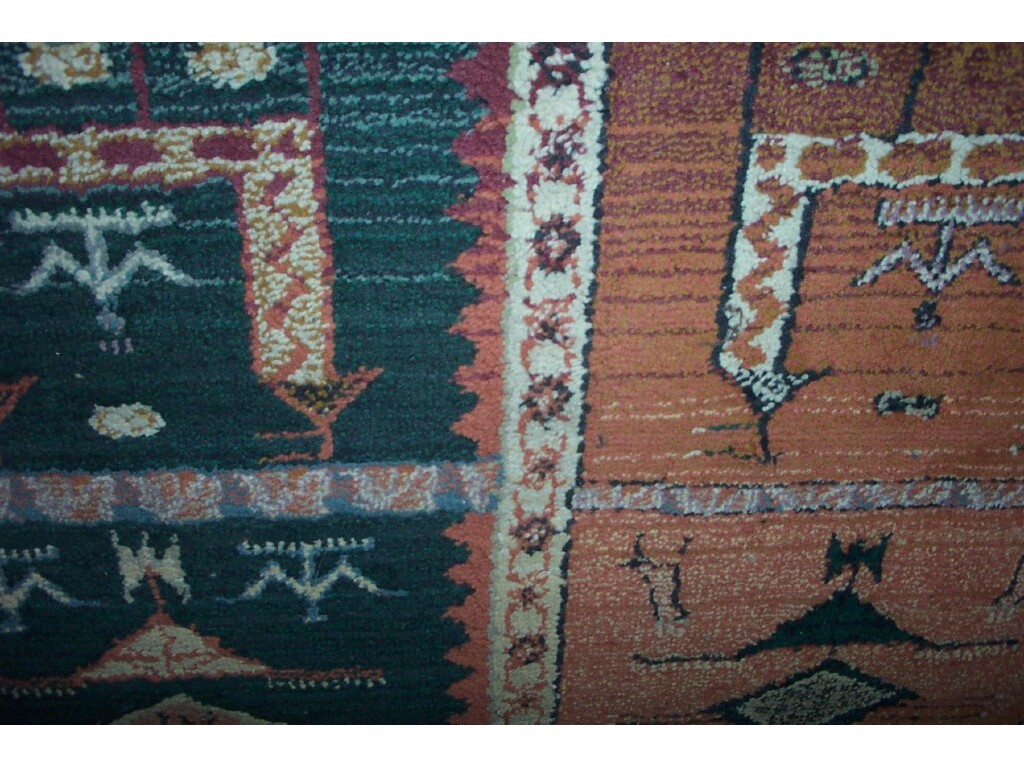 Appraisal: An Eastern style wool carpet with stylised animal and bird