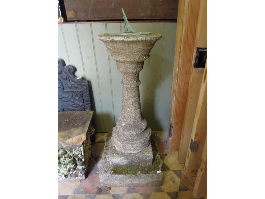 Appraisal: A weathered composition stone sundial with circular top raised on