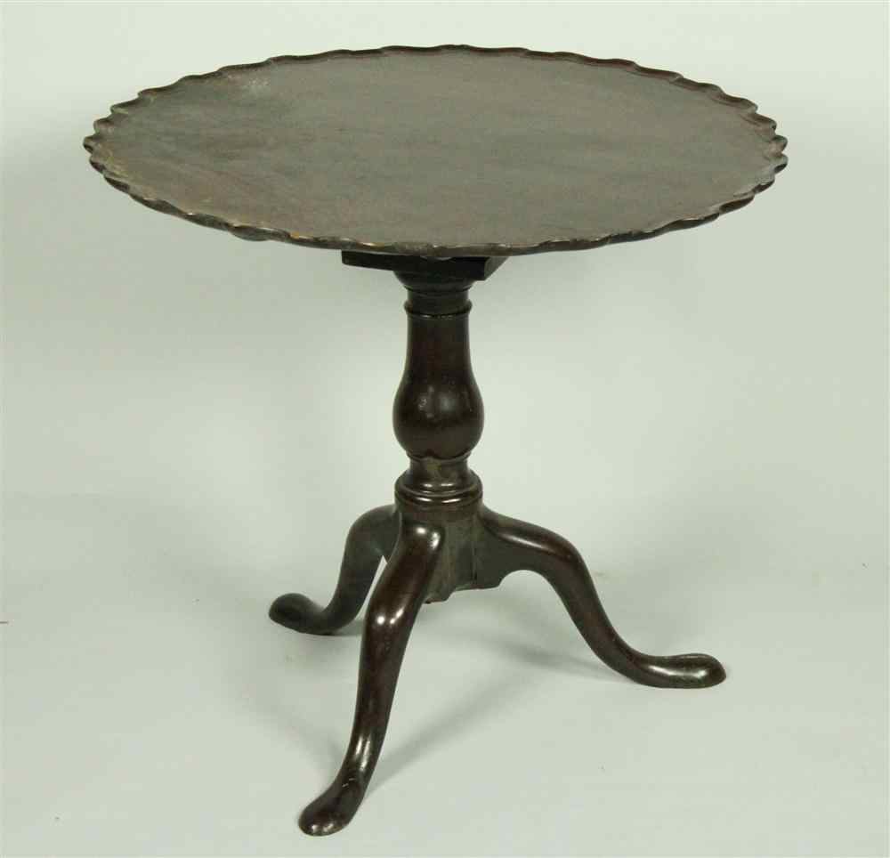 Appraisal: GEORGE III MAHOGANY PIE CRUST TEA TABLE circa having a