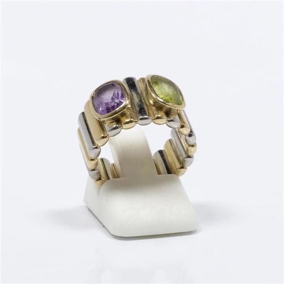 Appraisal: PERIDOT AND AMETHYST RING G BELIN Yellow and white gold