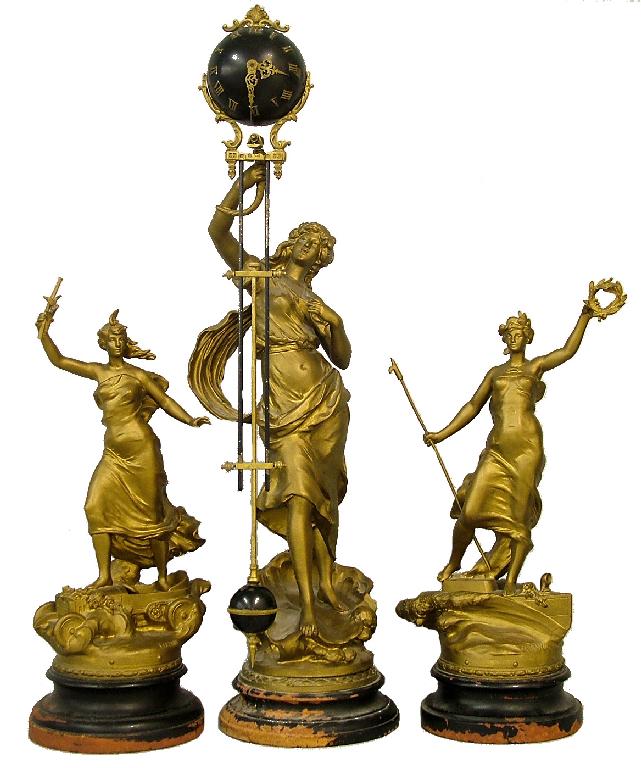 Appraisal: French spelter figural mystery clock garniture the swinging ball pendulum