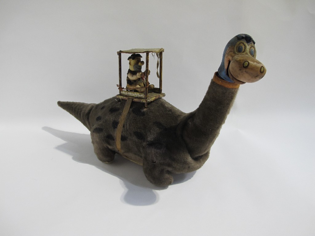 Appraisal: A 'Fred Flintstone Dino the Dinosaur' battery operated toy by