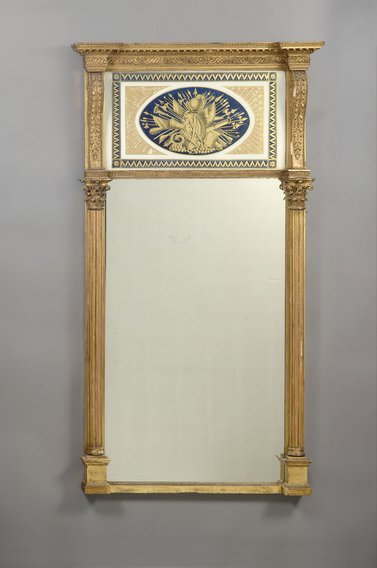 Appraisal: AMERICAN CLASSICAL CARVED GILTWOOD AND EGLOMISE MIRROR The dentil-carved cornice