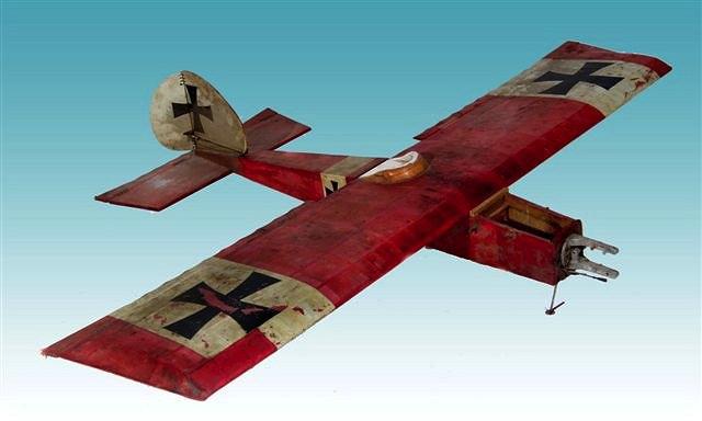 Appraisal: A MODEL FOCKER EINDECKER RED PAINTED AEROPLANE with a wing