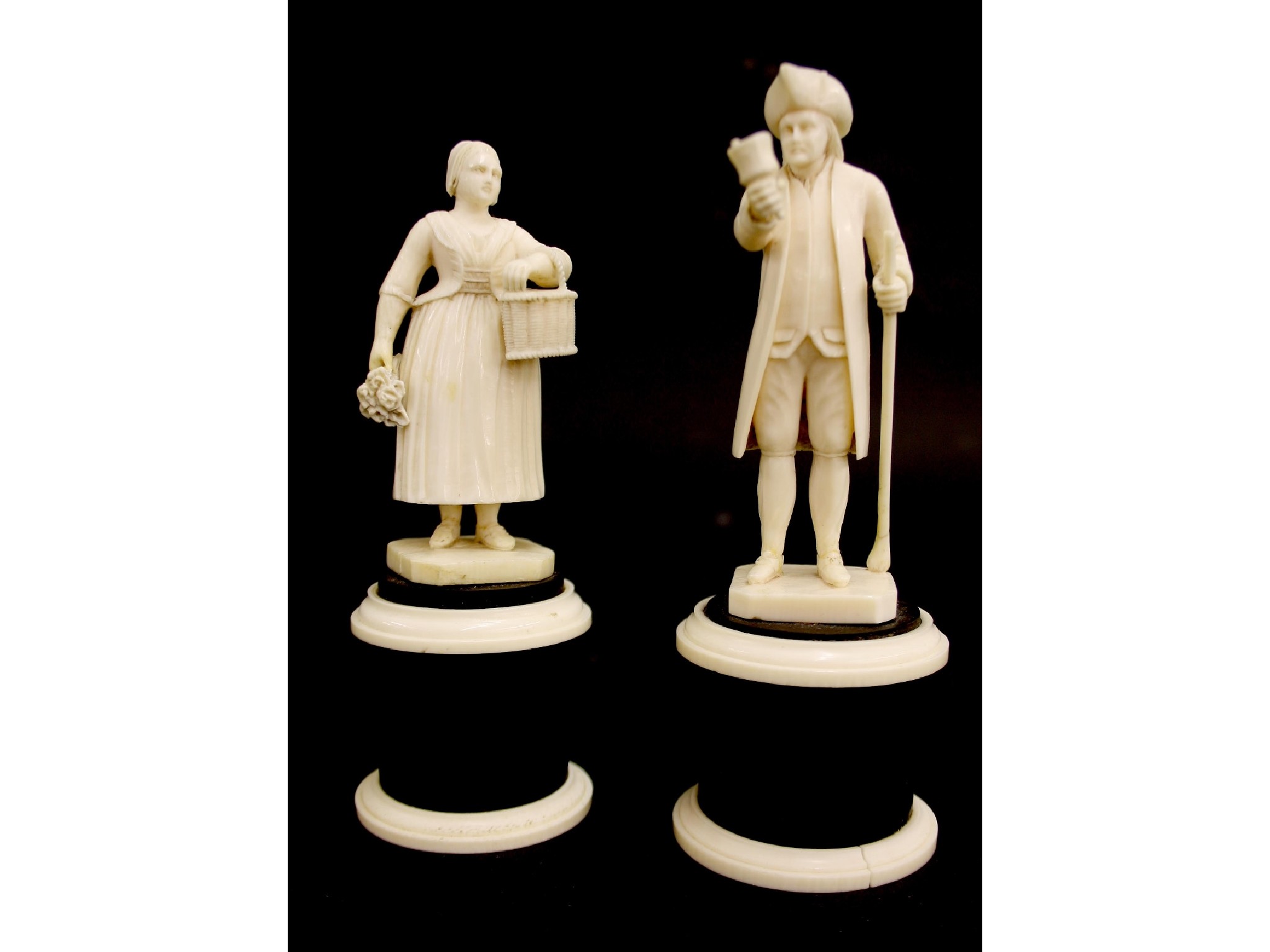 Appraisal: Pair of Dieppe ivory figures of a gentleman bell ringer