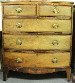 Appraisal: An early th Century mahogany bowfront chest of three long