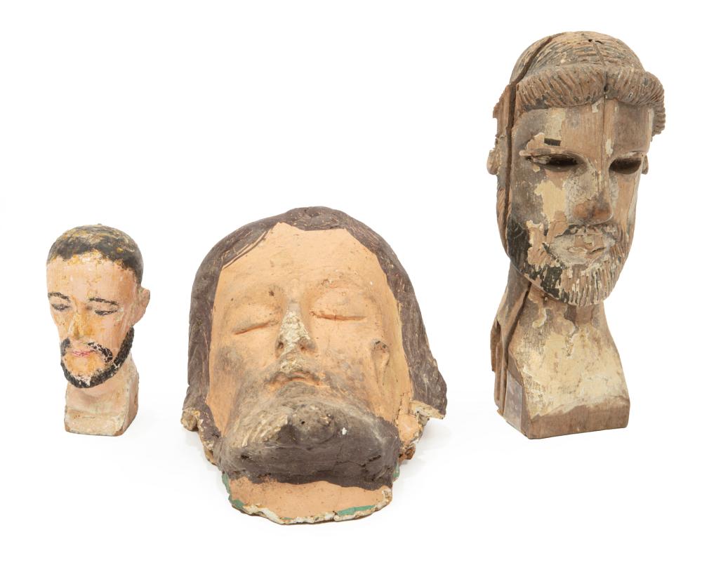 Appraisal: Three Antique Carved and Painted Wood Heads probably for Santos