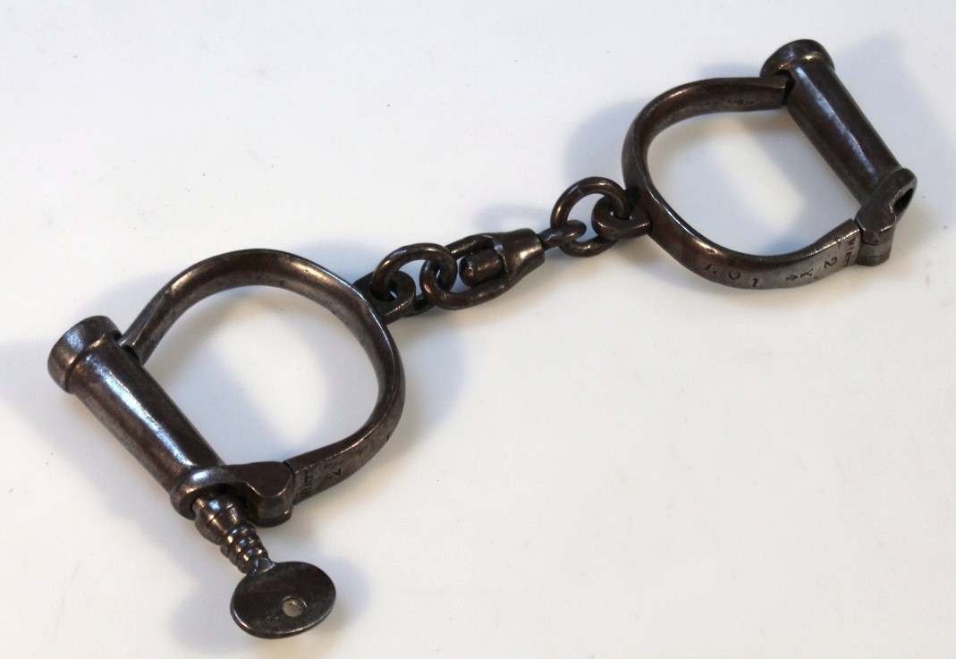 Appraisal: A pair of early thC Hiatt M C metal handcuffs