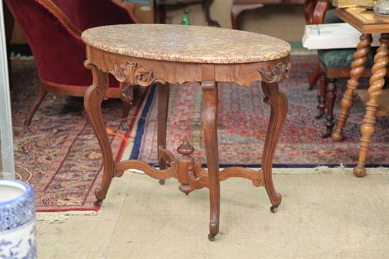 Appraisal: MARBLE TOP PARLOR TABLE Walnut with a mottled yellow and