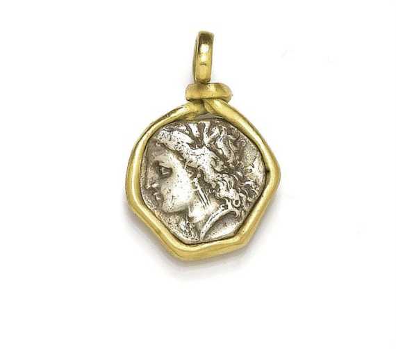 Appraisal: PENDANT WITH ANTIQUE COIN Yellow gold and silver Sober pendant