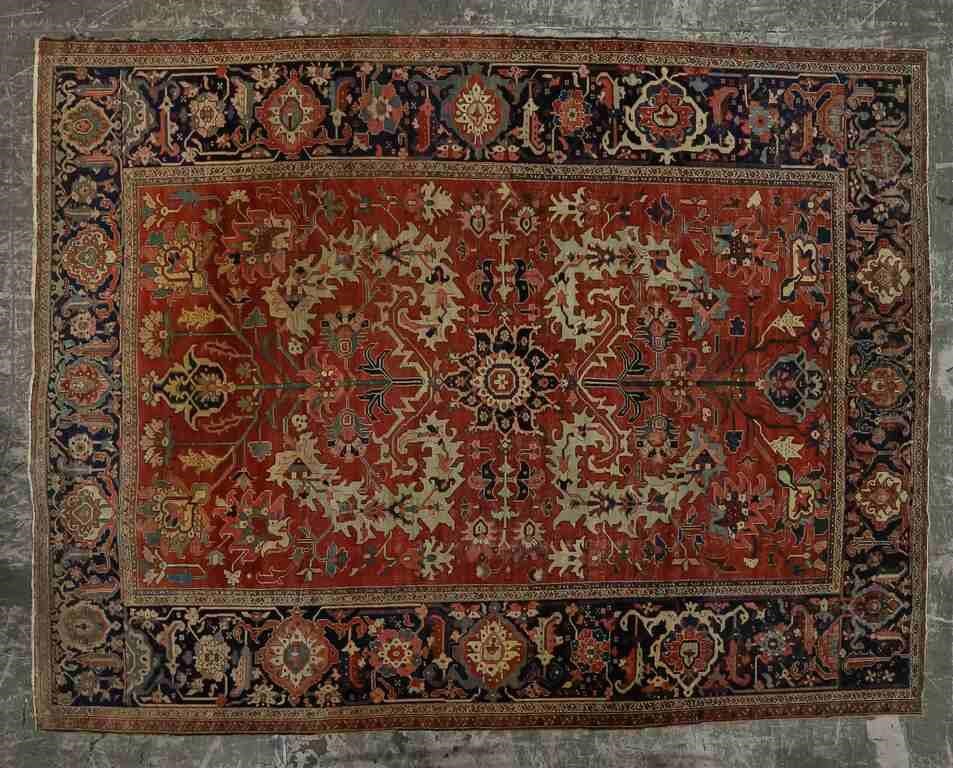 Appraisal: Serapi rug Blue and ivory colored medallion against terracotta red