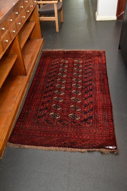 Appraisal: A TURKMAN PILE RUG IN RED AND NAVY TONES A