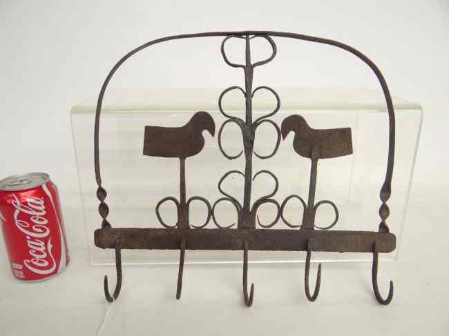 Appraisal: Iron hook rack with bird decoration '' W '' Ht