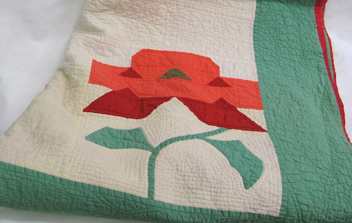 Appraisal: AMERICAN HANDMADE QUILT one side having red and coral rose