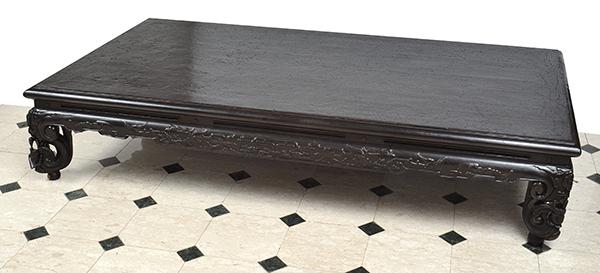 Appraisal: A CHINESE BLACK LACQUERED OPIUM BED rectangular with a carved