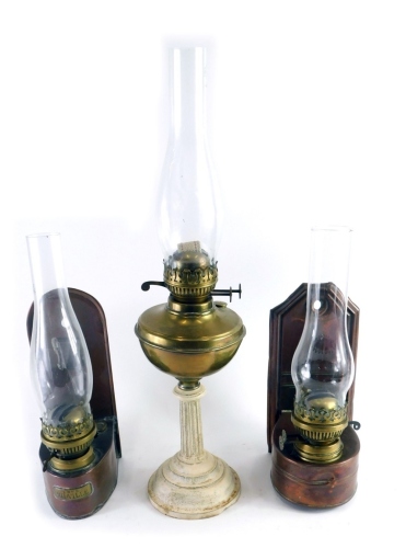 Appraisal: A brass table lamp with clear glass funnel brass reservoir