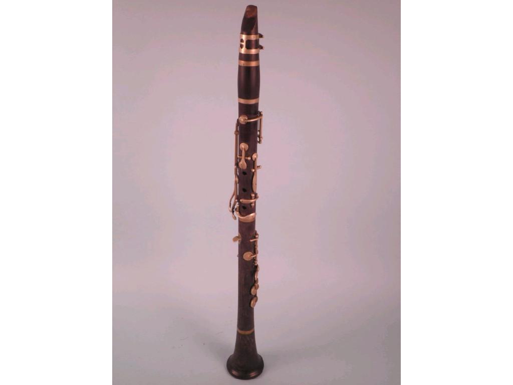 Appraisal: A turned rosewood clarinet by Boosey Co with nickel plated