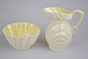 Appraisal: A Belleek bowl cm dia and cream jug cm high