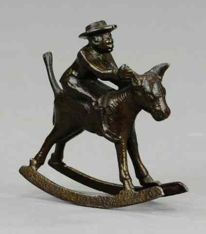 Appraisal: IVES MAN RIDING DONKEY ROCKER Cast iron c japanned finish