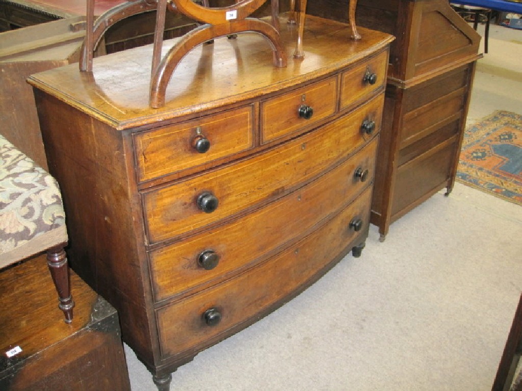 Appraisal: String inlaid oak bow front chest with three small drawers