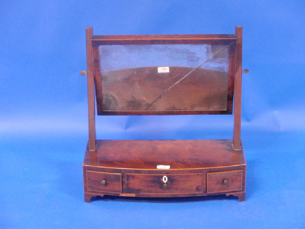 Appraisal: A George III flamed mahogany bow front dressing table mirror