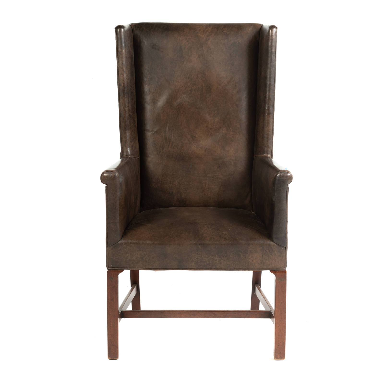 Appraisal: GEORGIAN STYLE LEATHER WING CHAIR th century with mahogany stretcher