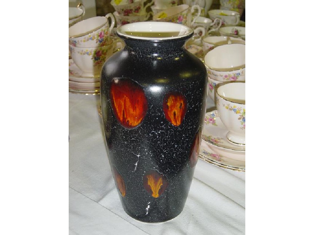 Appraisal: A Poole Pottery vase with abstract painted orange decoration on