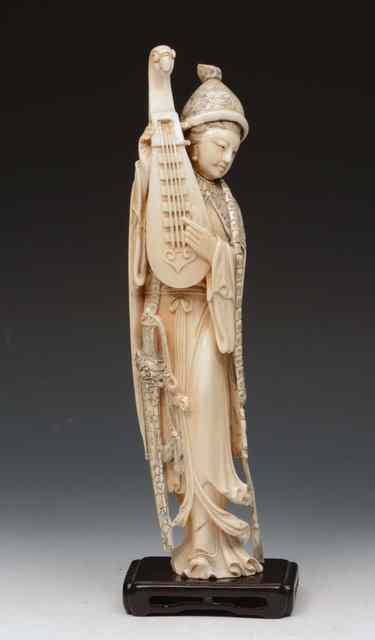 Appraisal: A CHINESE IVORY FIGURE OF A LADY MUSICIAN circa holding