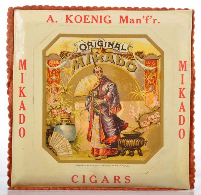 Appraisal: Mikado Cigars Change Receiver Description Beautiful celluloid over tin with