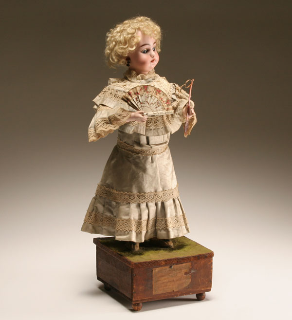 Appraisal: Simon Halbig bisque head automaton with fan and lorgnette the