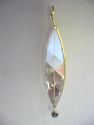 Appraisal: A CRYSTAL AND SAPPHIRE PENDANT the long navette faceted clear