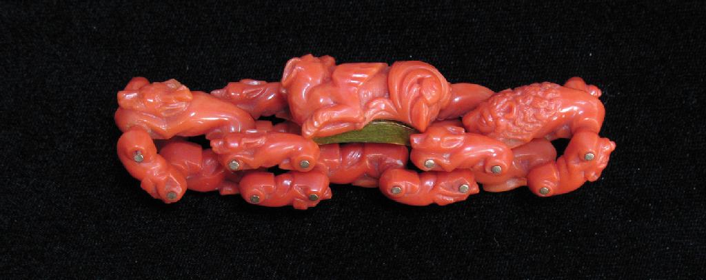 Appraisal: A VICTORIAN CORAL BRACELET each link carved as a rabbit