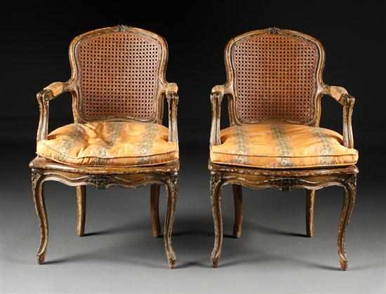 Appraisal: Pair of Louis XV style painted and caned fauteuils en