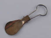 Appraisal: A white metal tests silver spoon with folding steel handle