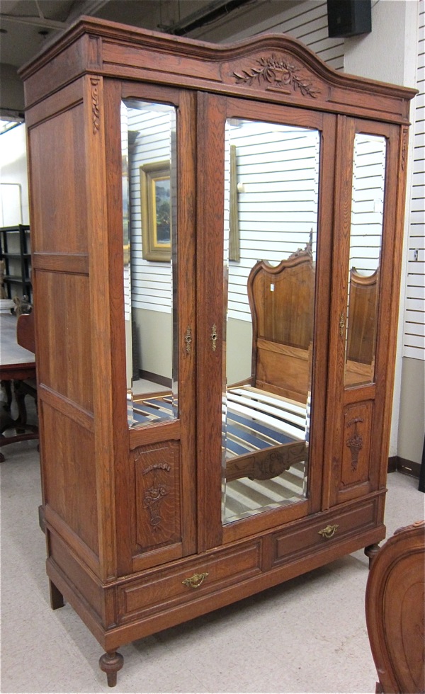 Appraisal: LOUIS XV STYLE THREE-DOOR OAK WARDROBE French c having three