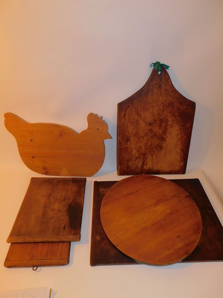 Appraisal: ANTIQUE CUTTING BOARDS antiue wood cutting boards to in long