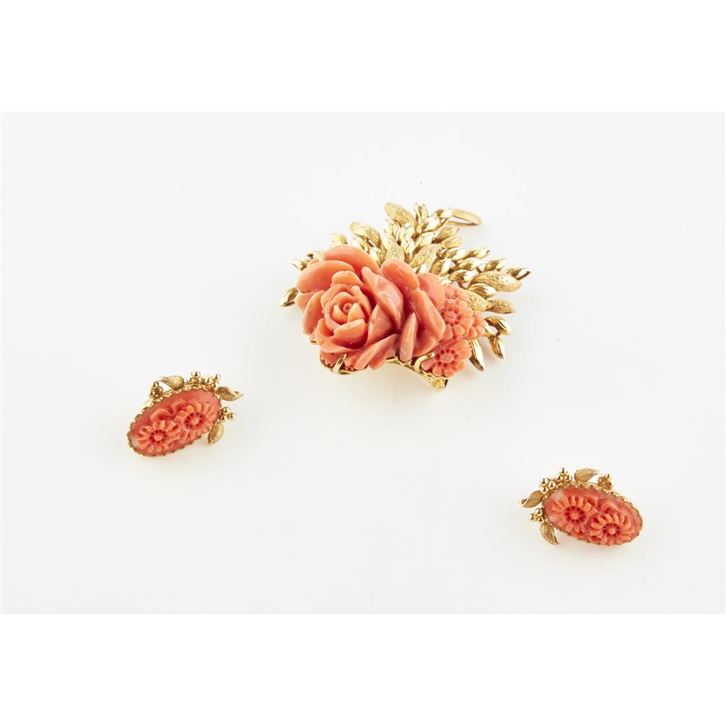 Appraisal: A coral set brooch and matching earrings the carved coral