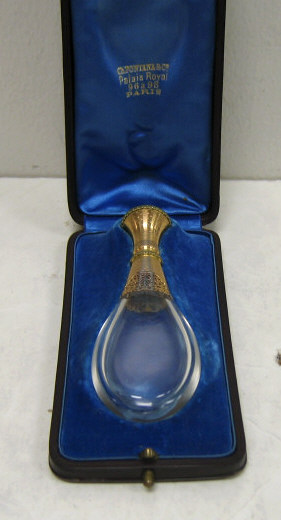 Appraisal: FRENCH GLASS AND GOLD PERFUME BOTTLE Laid down tear drop