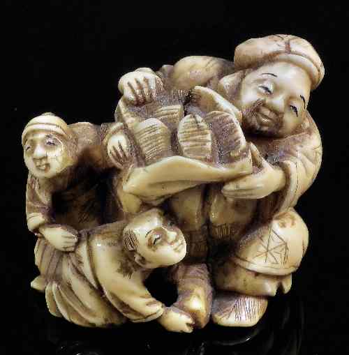 Appraisal: A Japanese ivory netsuke carved in the form of shoe