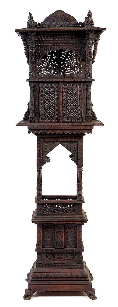 Appraisal: An Anglo-Indian Pierce Carved Shrine Cabinet Height x width x