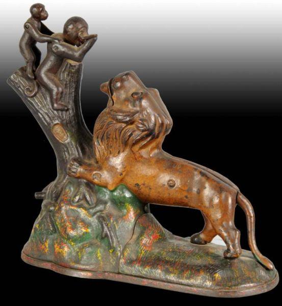 Appraisal: Cast Iron Lion Two Monkeys Mechanical Bank Description Works well