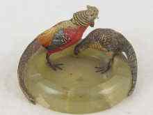 Appraisal: A pair of cold painted bronze pheasants on a turned