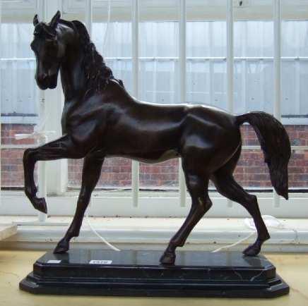 Appraisal: A patinated bronze stallion th century on stepped black rectangular