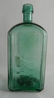 Appraisal: Medicine bottle Medicine- rectangular marked vertically on three panels 'John