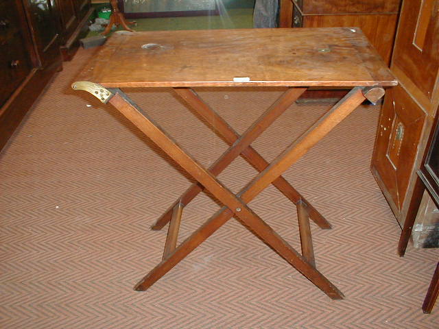 Appraisal: A Victorian mahogany butlers stand with folding base -