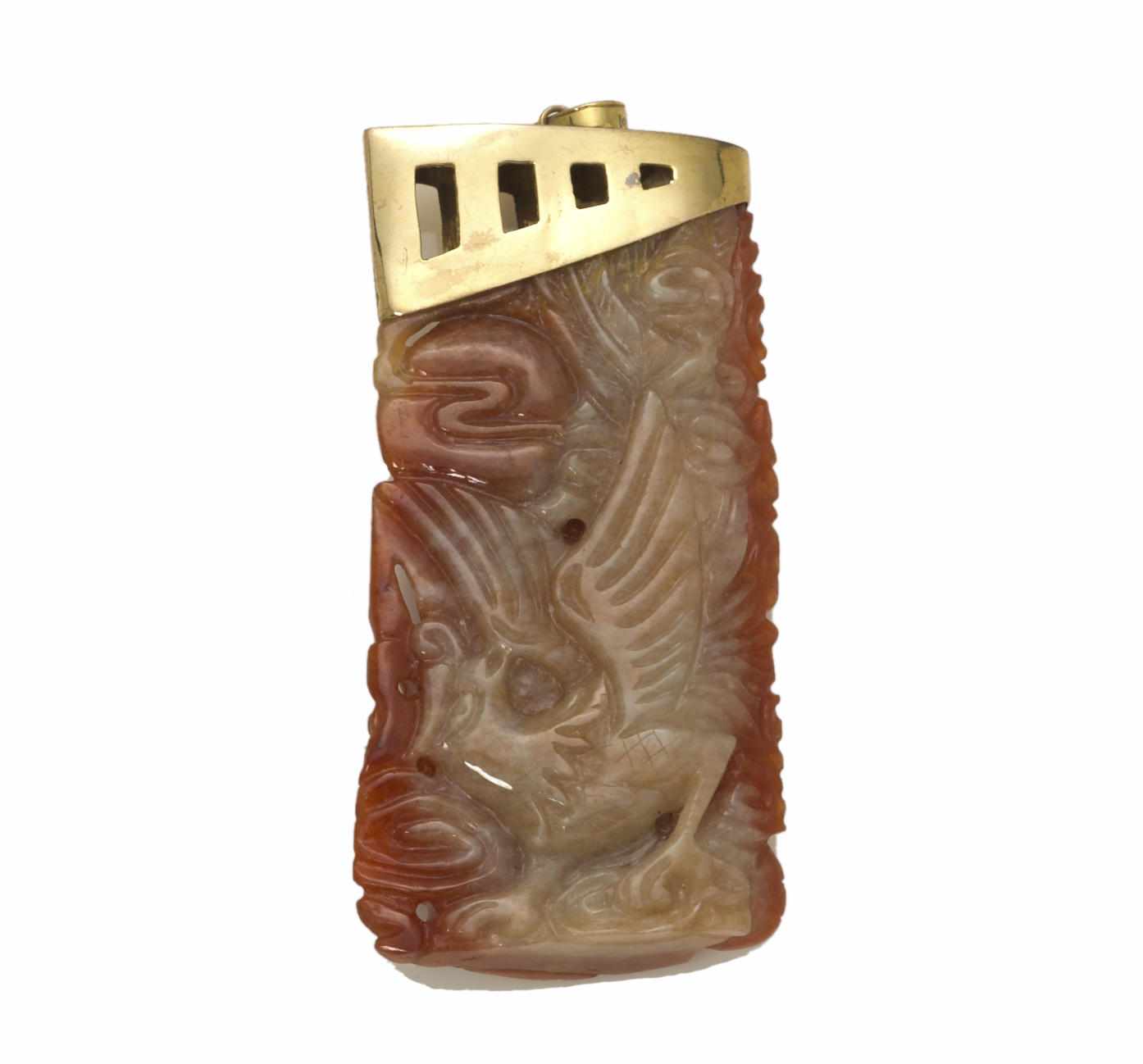 Appraisal: A carved red jade pendant dragon and bird carved jade